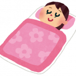 布団で睡眠をとる女性